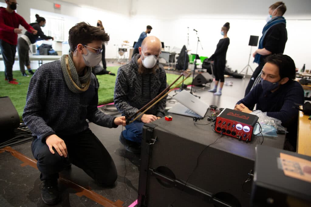 Danielle Buonaiuto, Dr Adam Tindale and Michael Hidetoshi Mori experimenting with prototypes in rehearsal. 