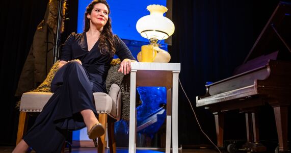 Photo of Mireille Asselin by Dahlia Katz Mireille Asselin sitting in a chair and smiling